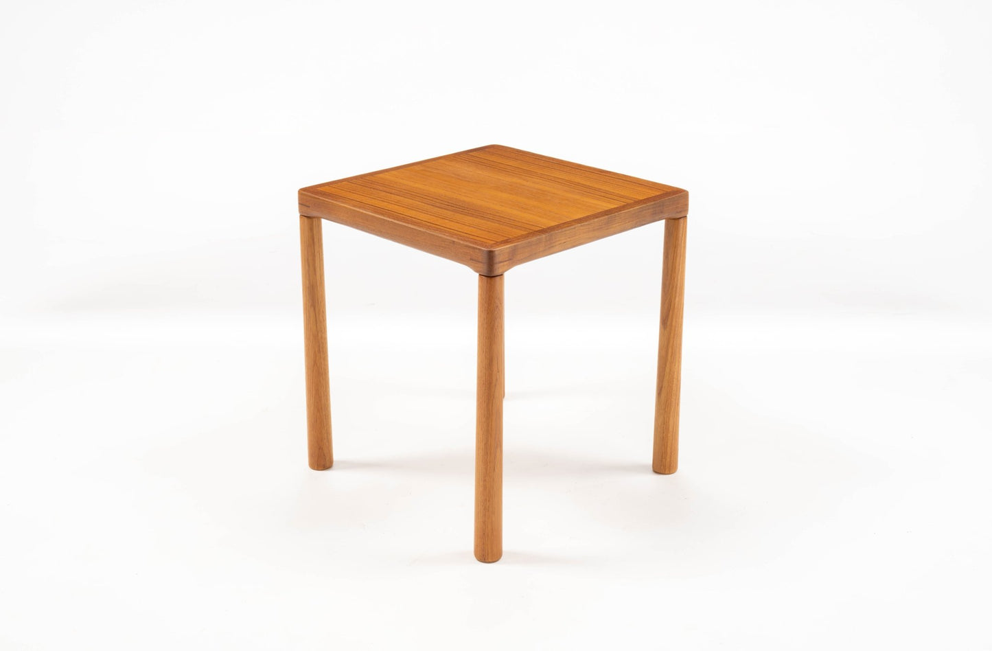 Mid-century modern teak side table with oak legs and finger joint detail on top corners, minimalist Swedish design