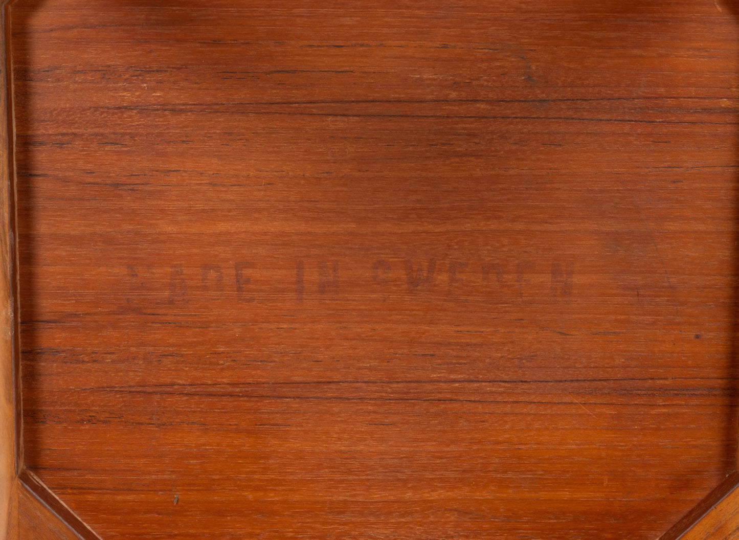 Close-up of teak side table top showing finger joint detail and natural wood grain finish