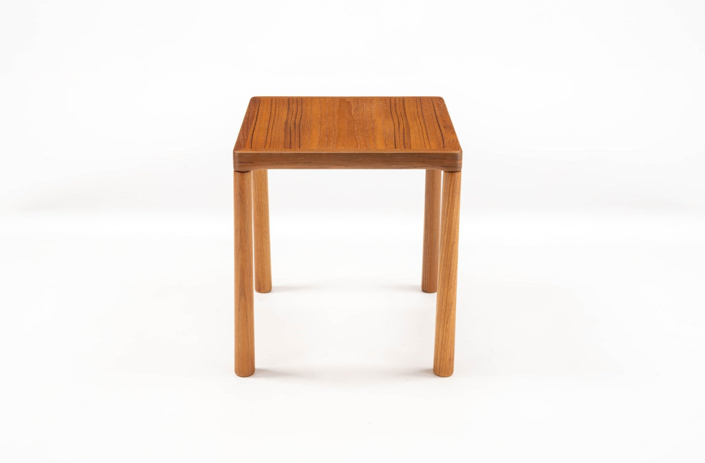 Pair of mid-century modern teak side tables with oak legs and finger joint details on top corners, Scandinavian design.