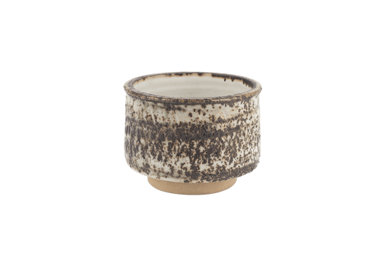 Tessa Kidick studio pottery bowl with low cylindrical form and mottled glaze in ivory, charcoal, and earthy brown tones