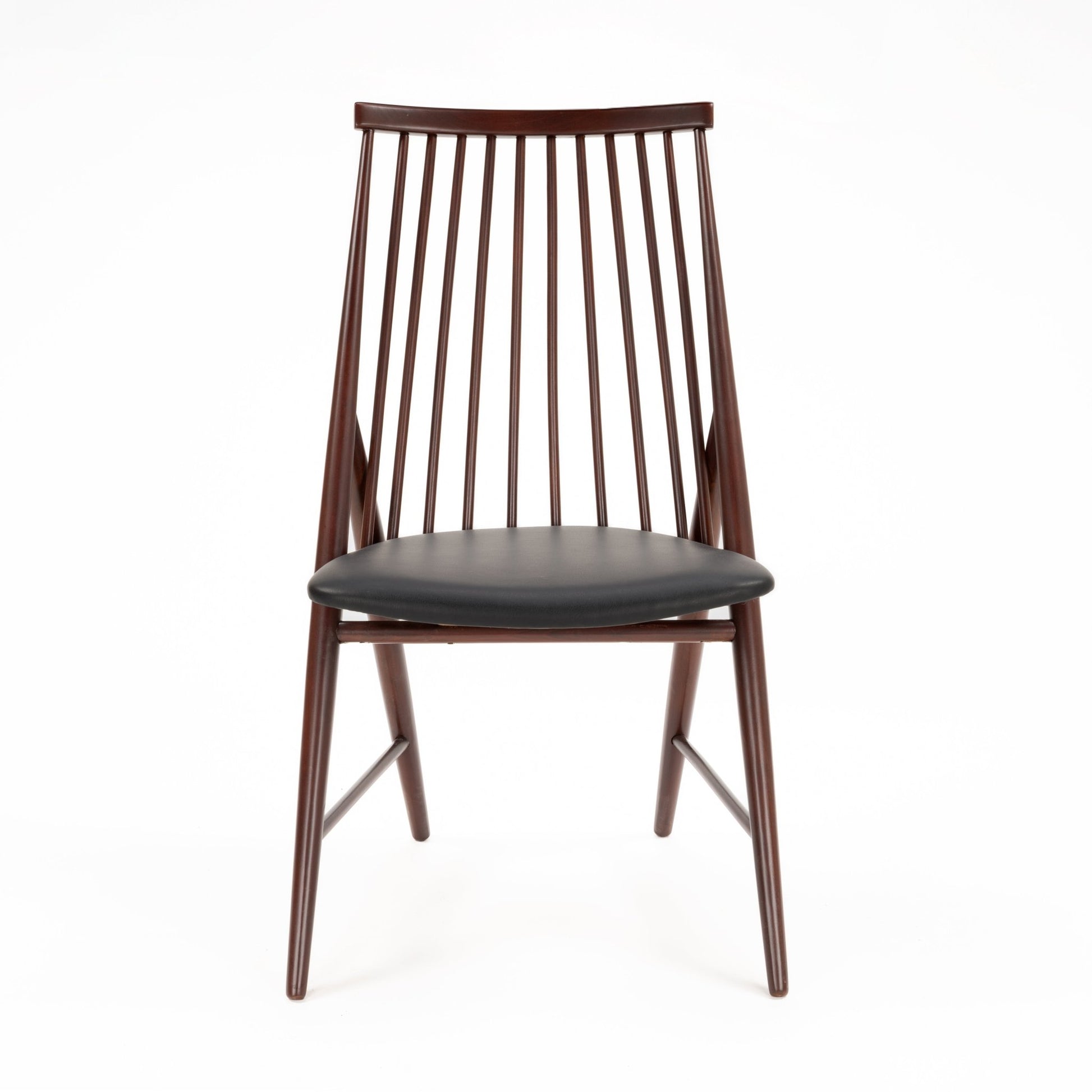 Front view of wooden spindle back chair with dark brown finish and black cushioned seat