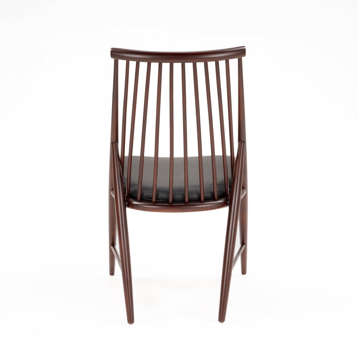 Rear view of slender wooden chair with multiple vertical spindles and black cushioned seat in dark finish