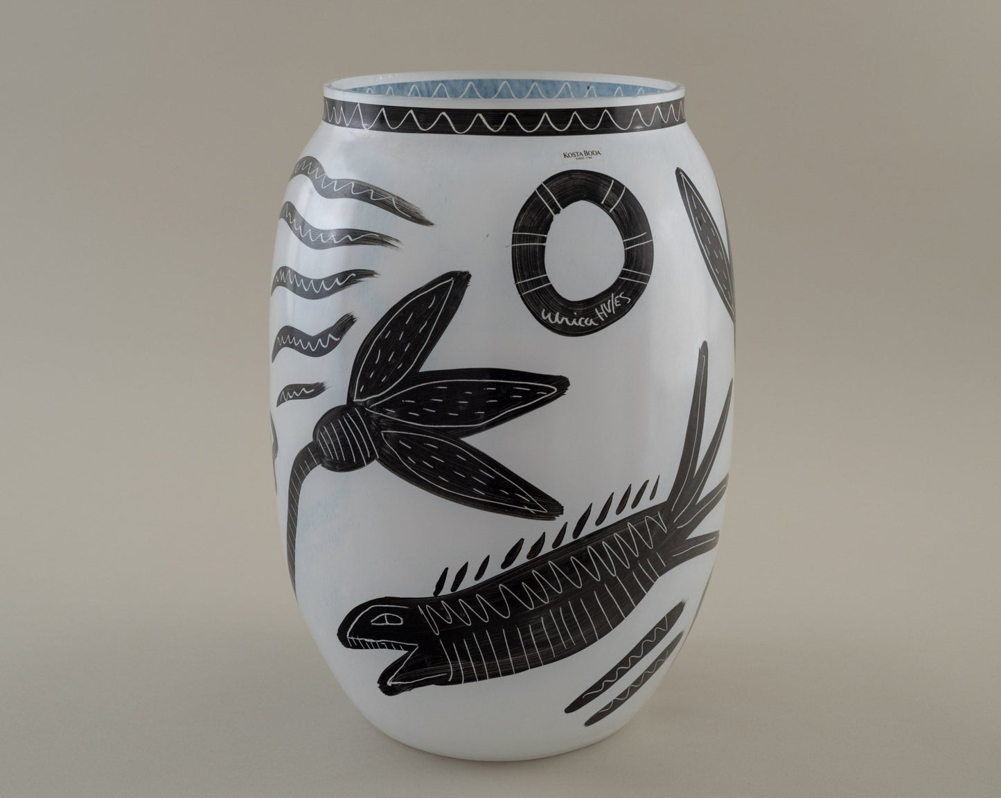 Ulrica Hydman-Vallien "Caramba" vase for Kosta Boda with black hand-painted serpent and floral motifs on white glass