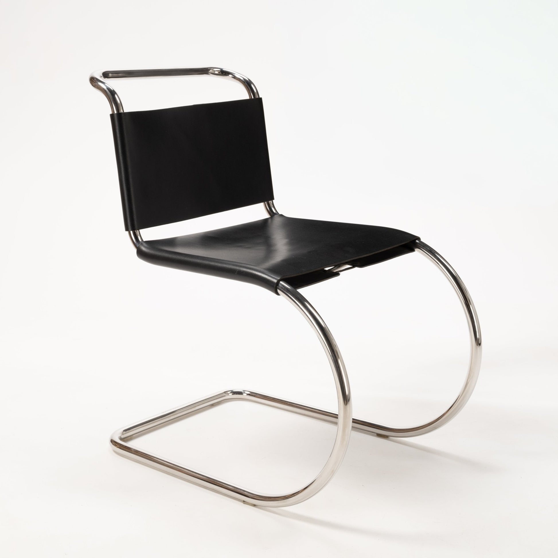 Van Der Rohe MR10 cantilever chair with polished chrome tubular frame and black leather seat and backrest