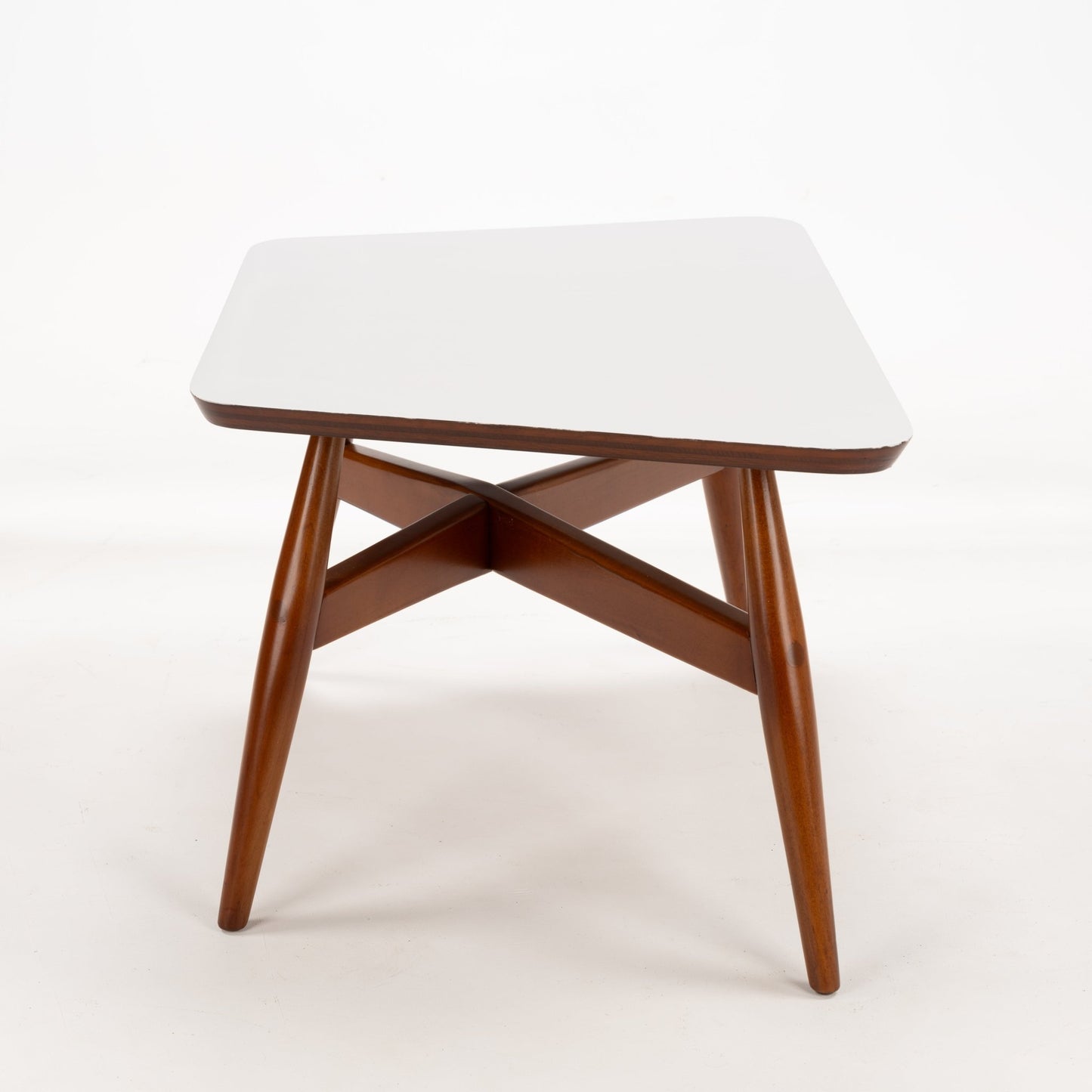 Walnut Side Table with Laminate Top featuring a smooth white surface supported by warm walnut legs connected with an intersecting crossbeam structure, reflecting mid century modern furniture design.