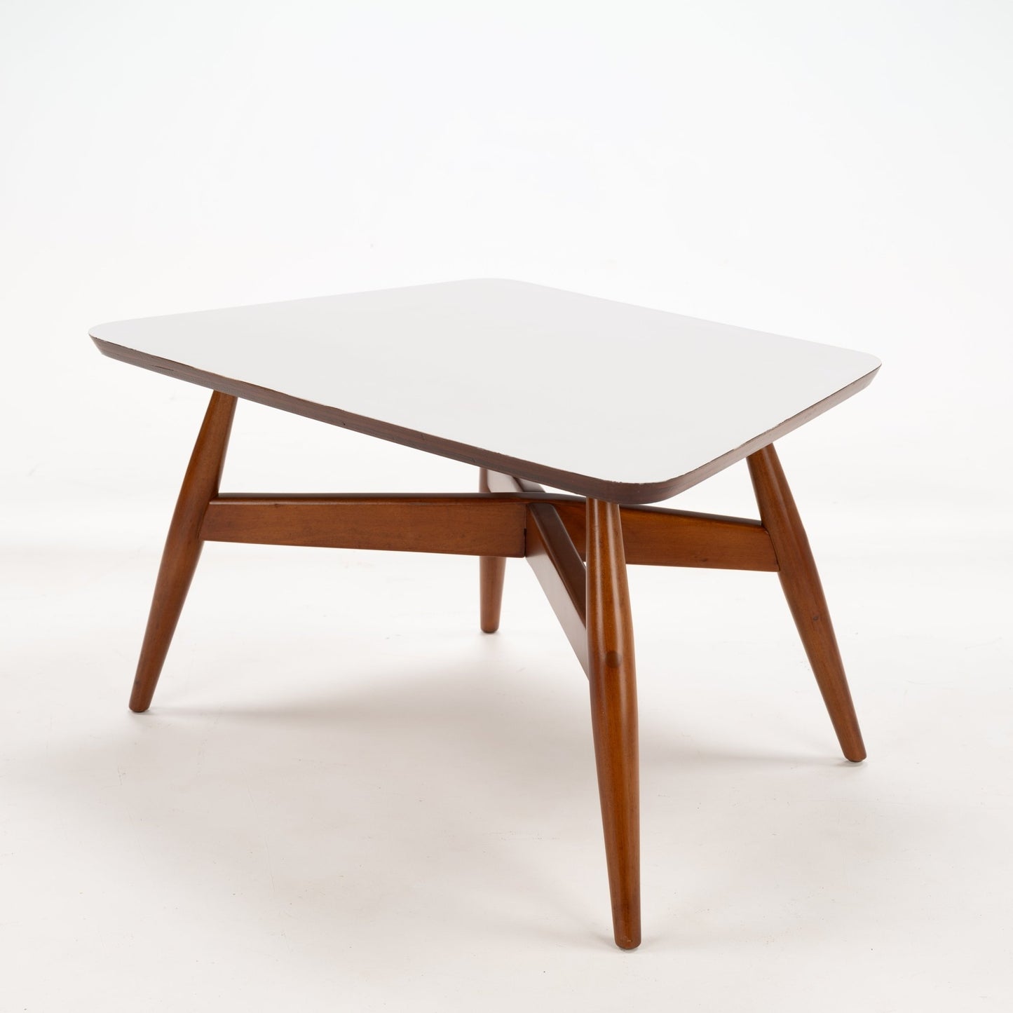 Walnut Side Table with Laminate Top showcasing a smooth white surface supported by angled warm walnut legs connected with an A-frame cross support, reflecting mid century modern furniture style.