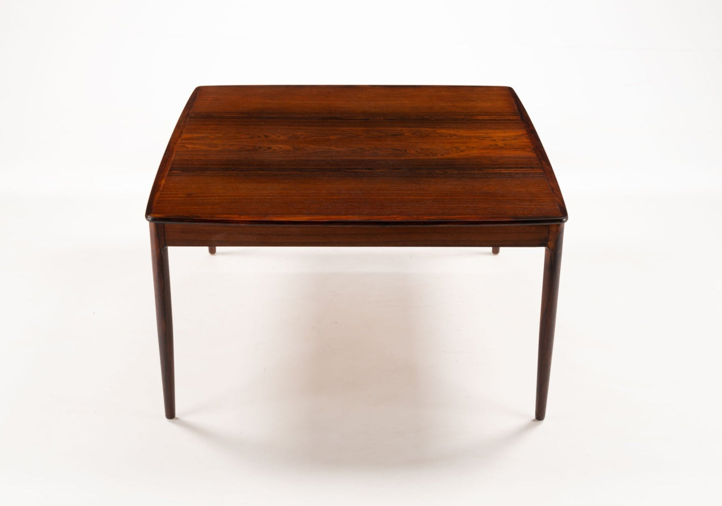 Yngvar Sandstrom rosewood coffee table for Seffle with bookmatched top and minimalist mid-century modern design