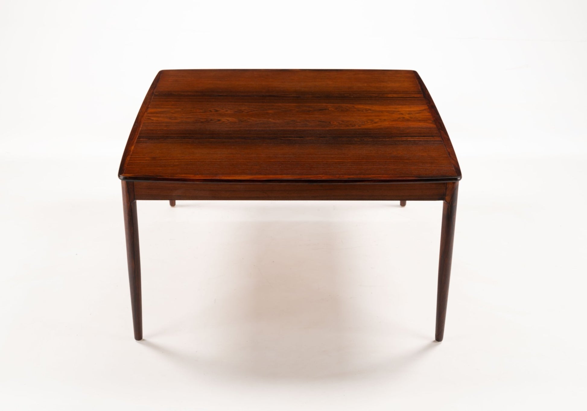 Yngvar Sandstrom rosewood coffee table for Seffle with bookmatched top and minimalist mid-century modern design