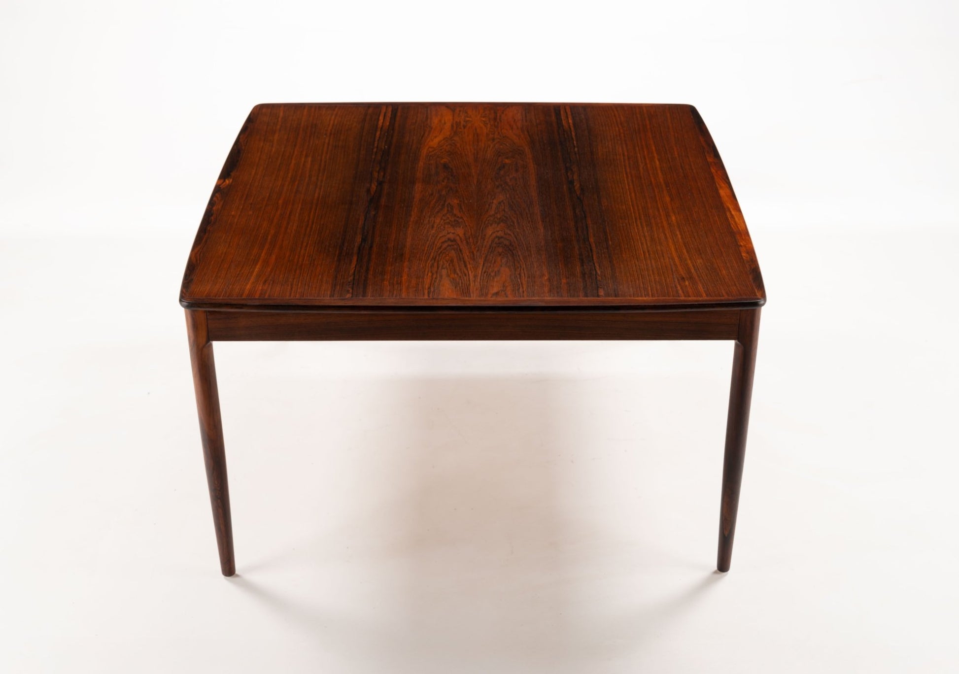 Mid-century modern Yngvar Sandstrom rosewood coffee table with bookmatched top for Seffle Mobelfabrik.
