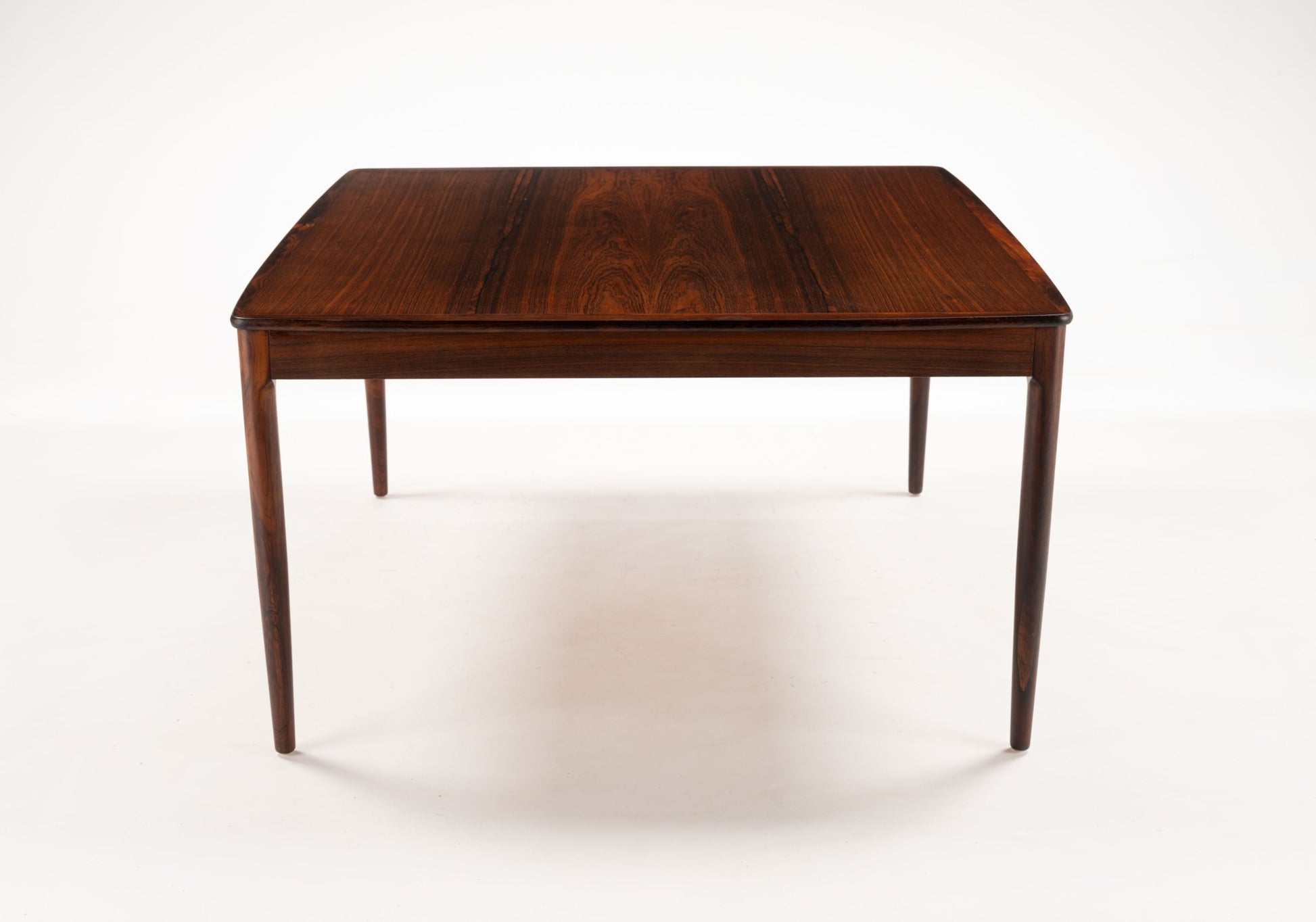 Yngvar Sandstrom rosewood coffee table for Seffle with bookmatched top and elegant mid-century modern design