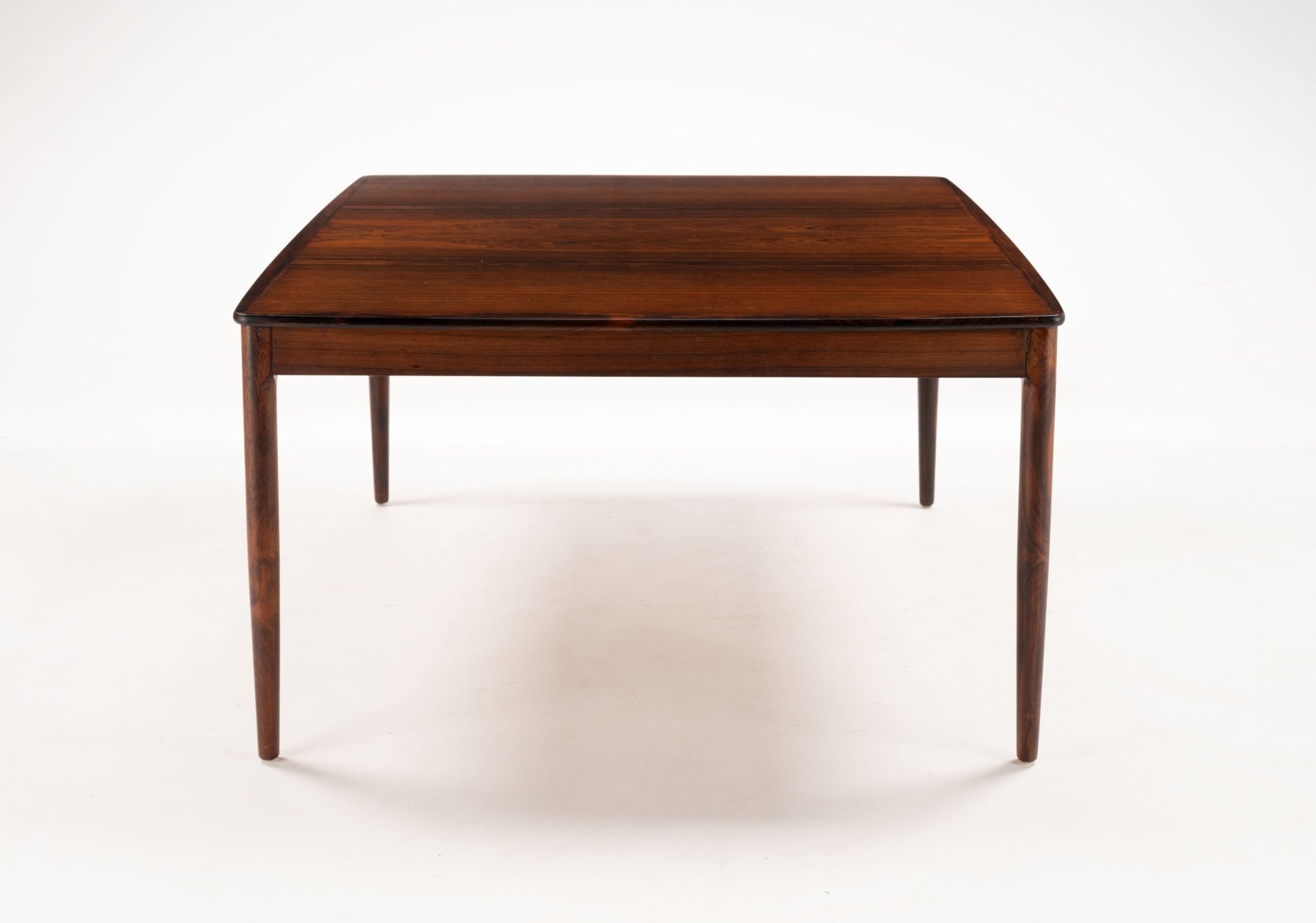 Yngvar Sandstrom rosewood coffee table for Seffle Mobelfabrik with bookmatched top and minimalist mid-century design