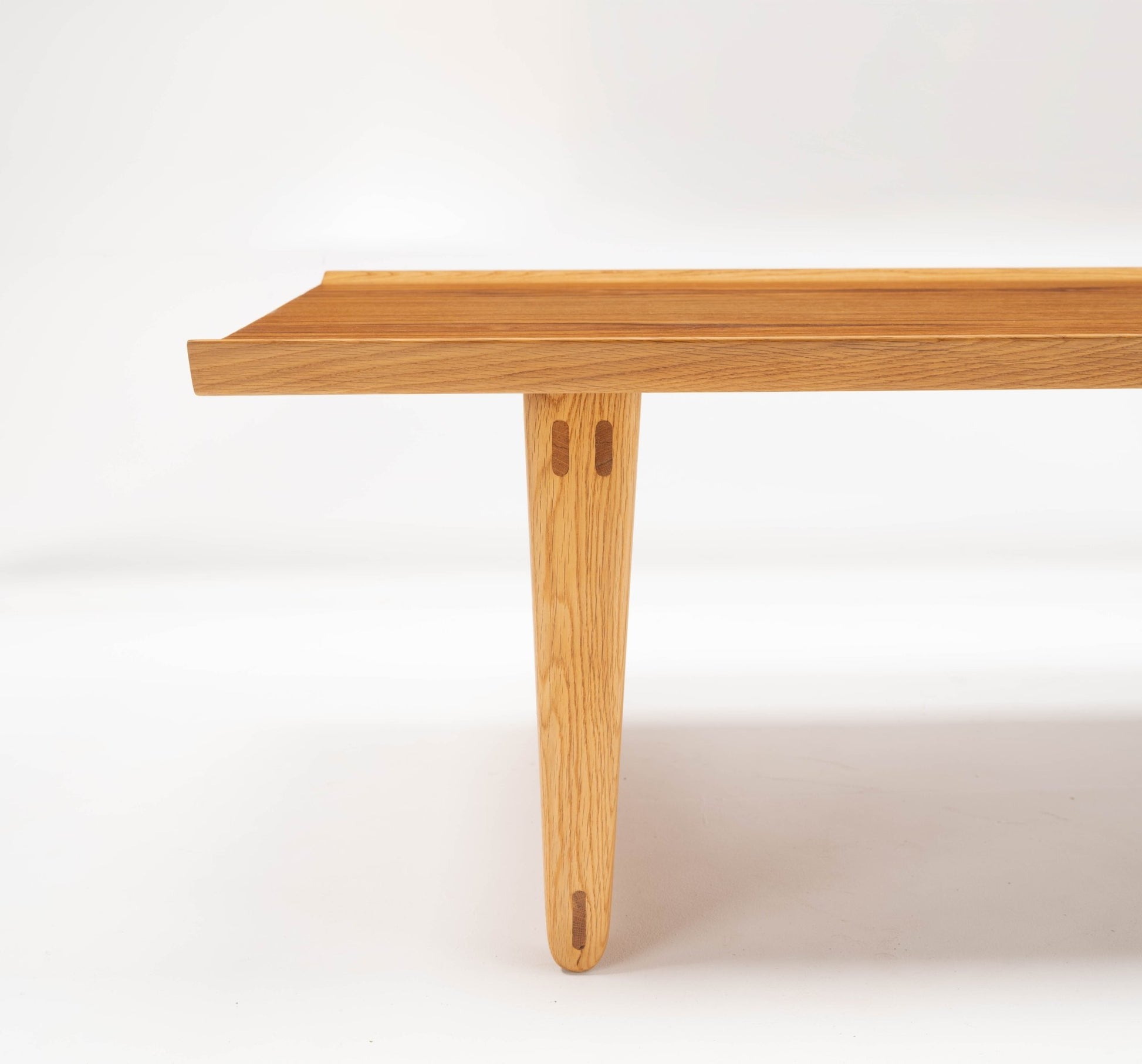 Mid-century modern Yngve Ekstrom coffee table leg detail in oak with teak accents and clean Scandinavian design