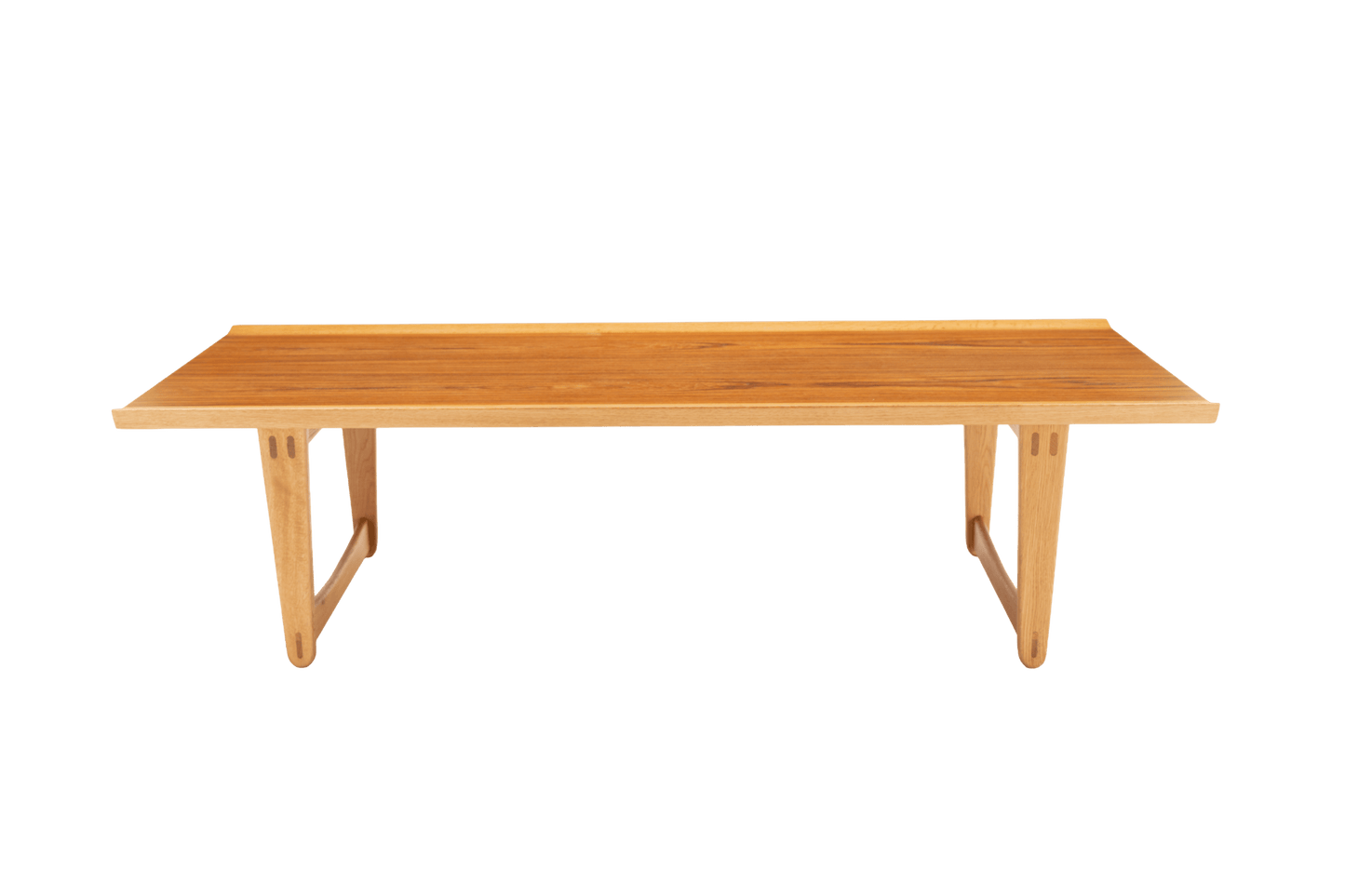 Mid-century modern Yngve Ekstrom coffee table in teak and oak with rectangular top and sculptural angled legs