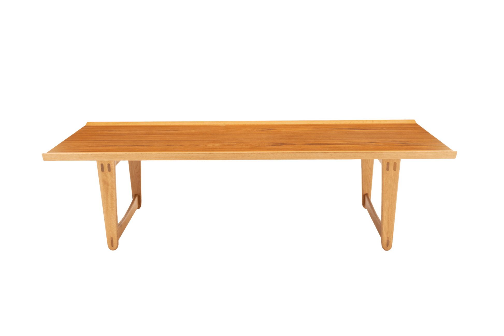 Mid-century modern Yngve Ekstrom coffee table in teak and oak with rectangular top and sculptural angled legs