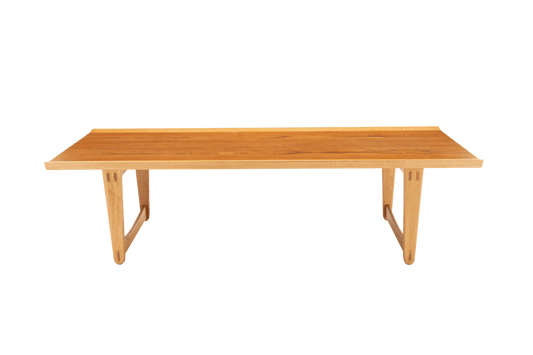 Mid-century modern Yngve Ekstrom coffee table in teak and oak with rectangular top and sculptural angled legs