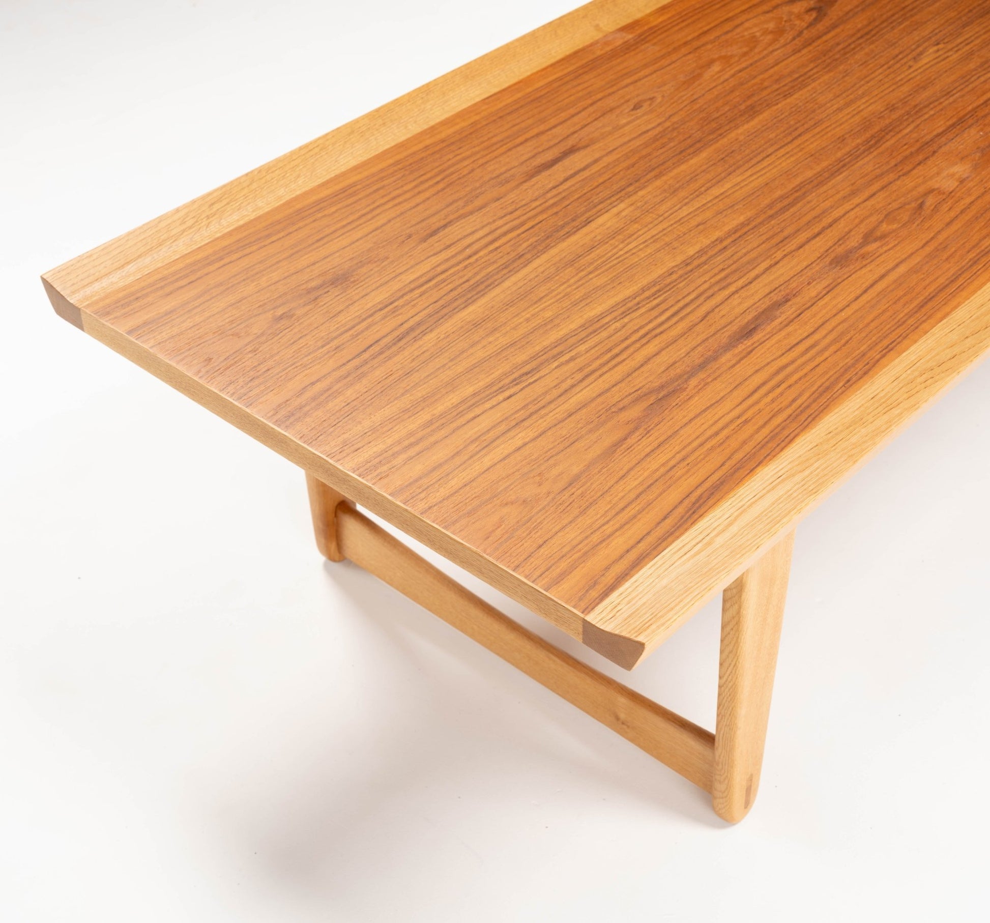 Yngve Ekstrom mid-century modern coffee table with teak top and oak frame, featuring clean lines and Scandinavian design.