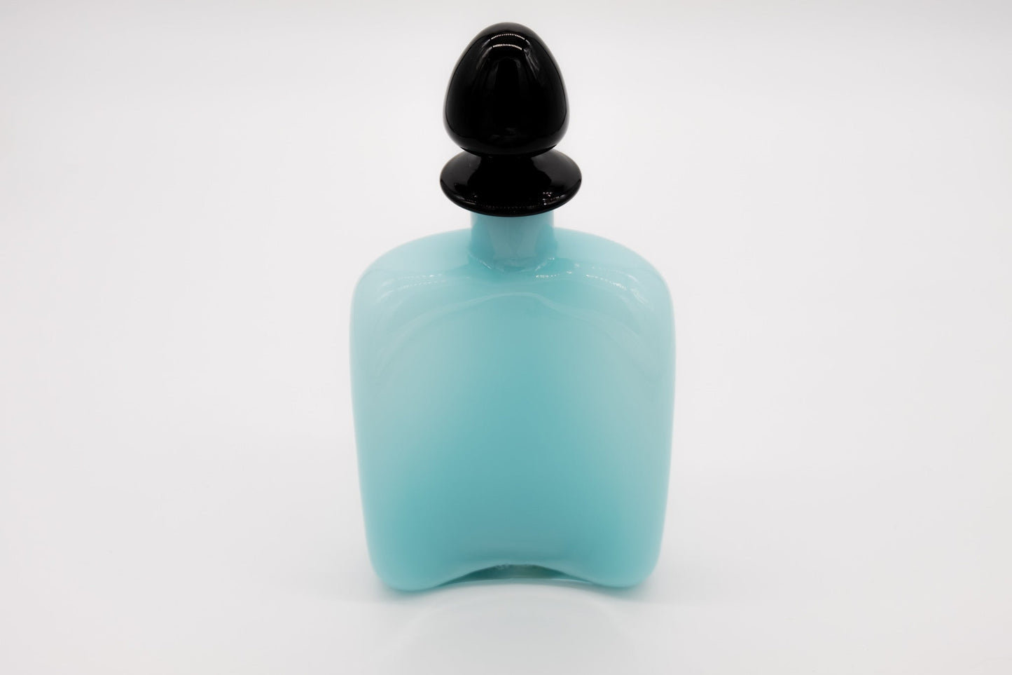 Carlo Moretti Murano glass decanter with rounded black stopper and soft blue frosted body labeled and signed