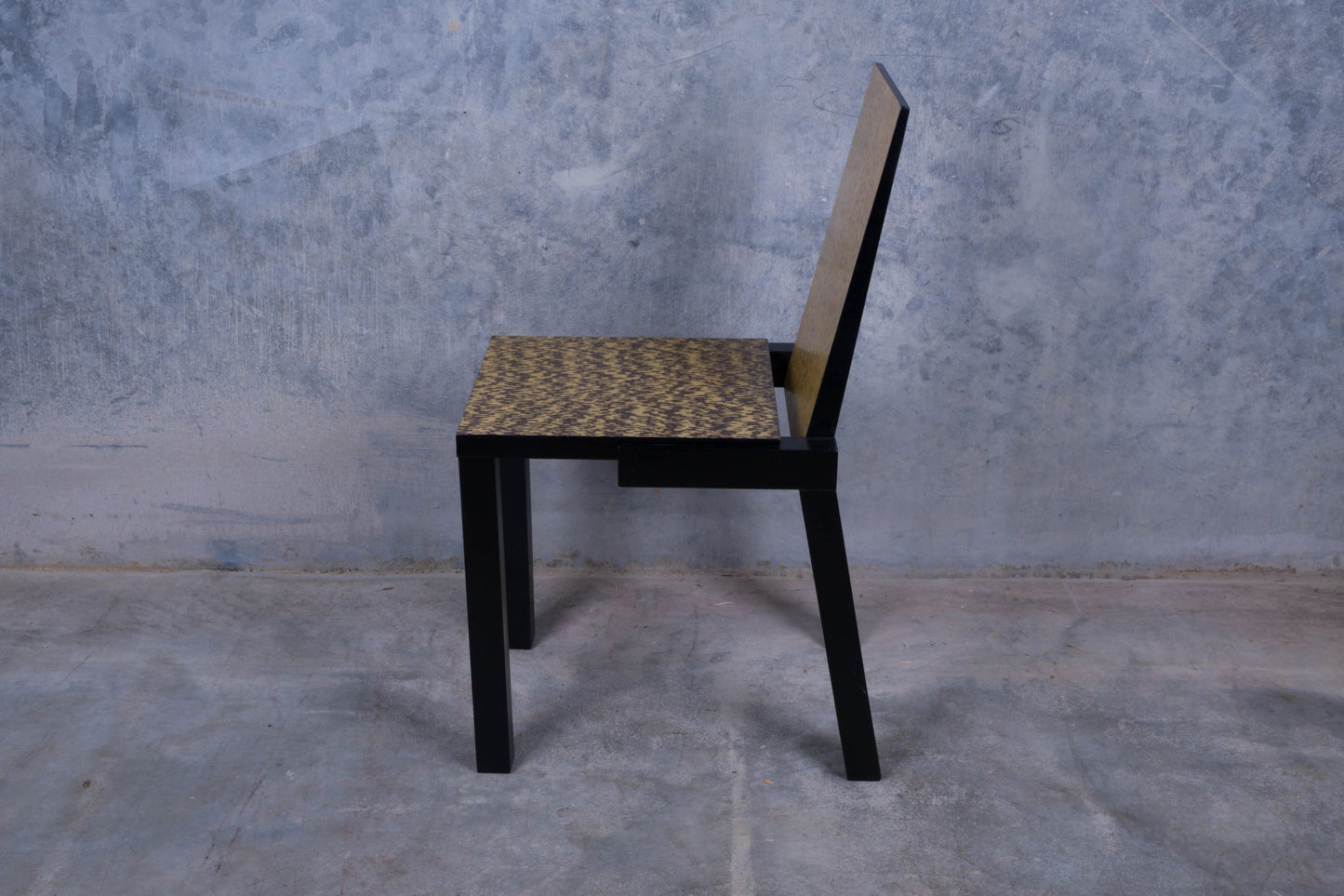 Constantin Boym chair with birdseye veneer backrest and contrasting black and ivory seat on black legs
