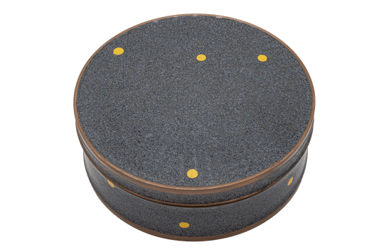 Round Fabienne Jouvin copper canister with black and gray speckled background and bronze spherical pattern with yellow dots