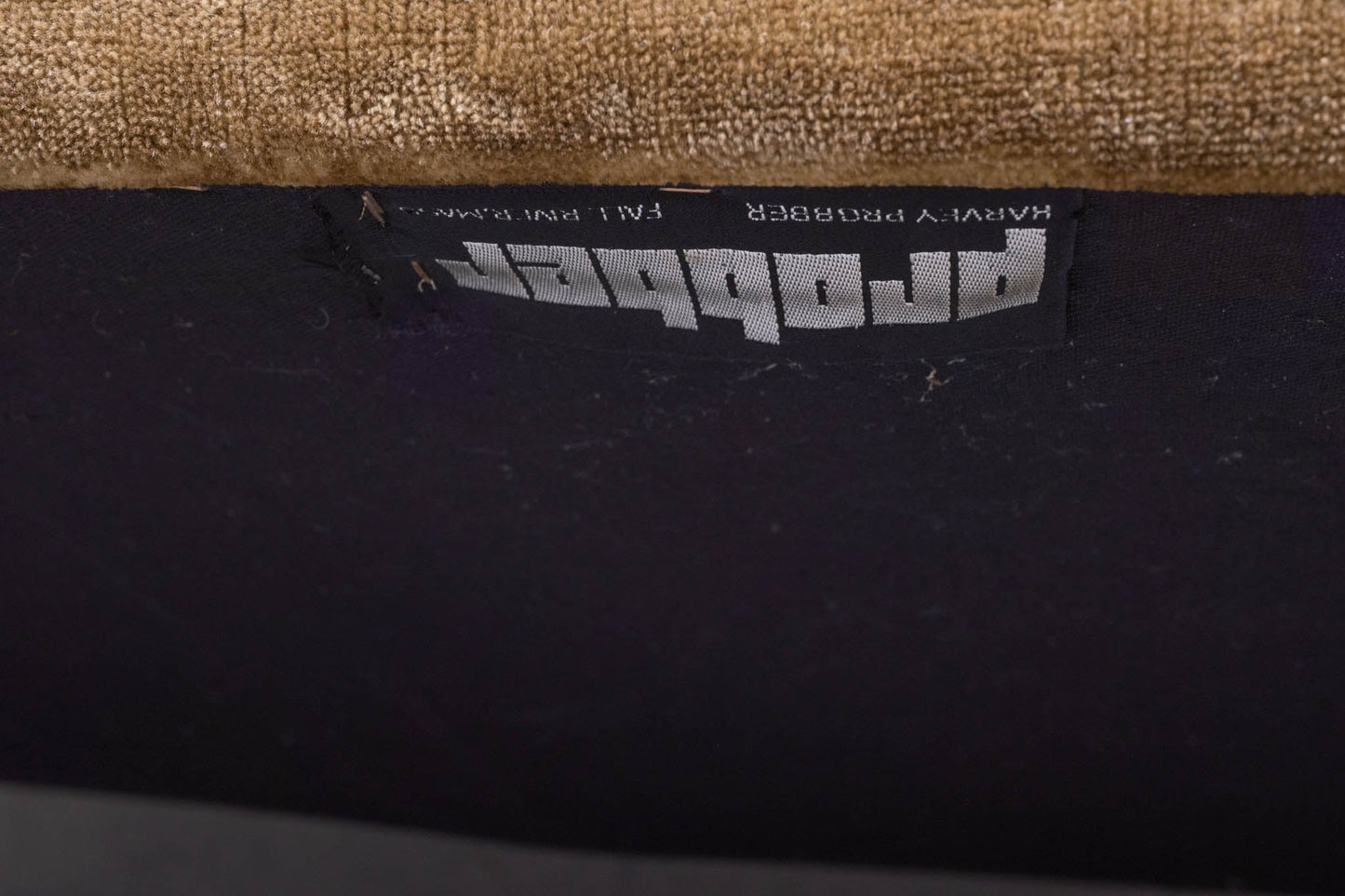 Close-up of vintage 1960s Harvey Probber upholstery label on settee with crushed velvet fabric in the United States