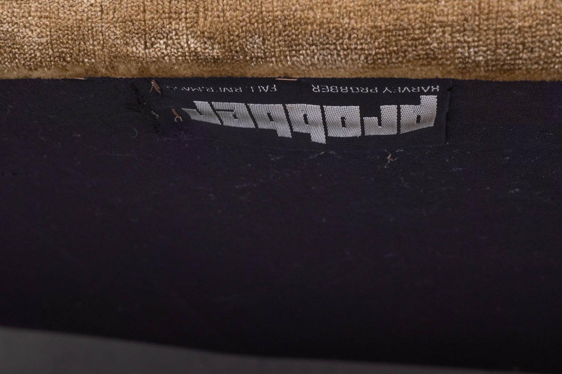 Close-up of vintage 1960s Harvey Probber upholstery label on settee with crushed velvet fabric in the United States