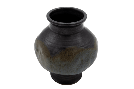 Spherical studio ceramic vase with indented body and multi-colored glaze, signed on the bottom.