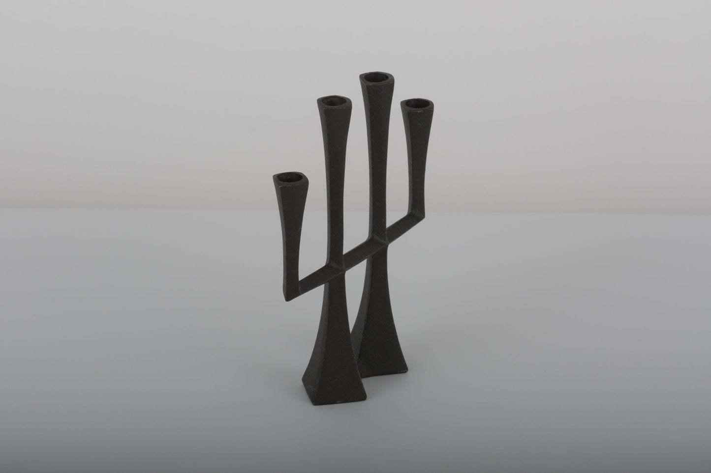 Pair of black Jens Quistgaard Danish cast iron candle holders from the 1950s with four candle sockets each