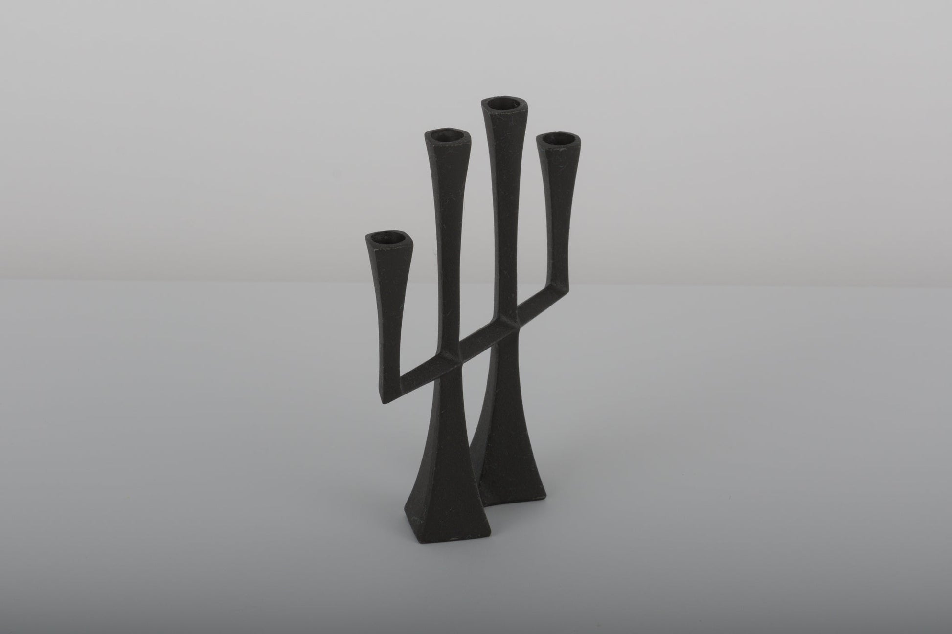 Pair of black Jens Quistgaard Danish cast iron candle holders from the 1950s with four candle sockets each
