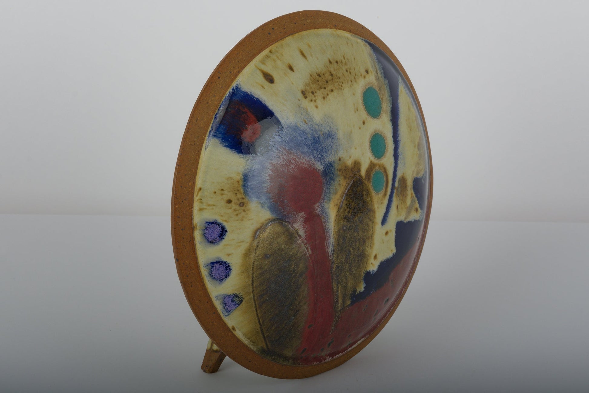Oval Ken Pick studio pottery vase from the 1980s with abstract glazing and unique ceramic design on wooden stand