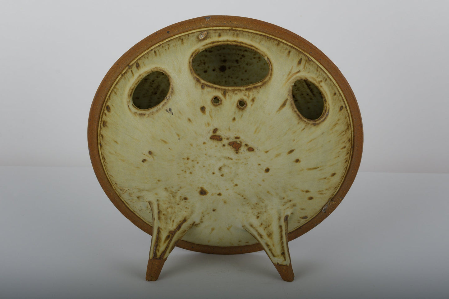 Ken Pick Studio pottery vase from the 1980s with unique oval shape and triple openings on a three-legged base