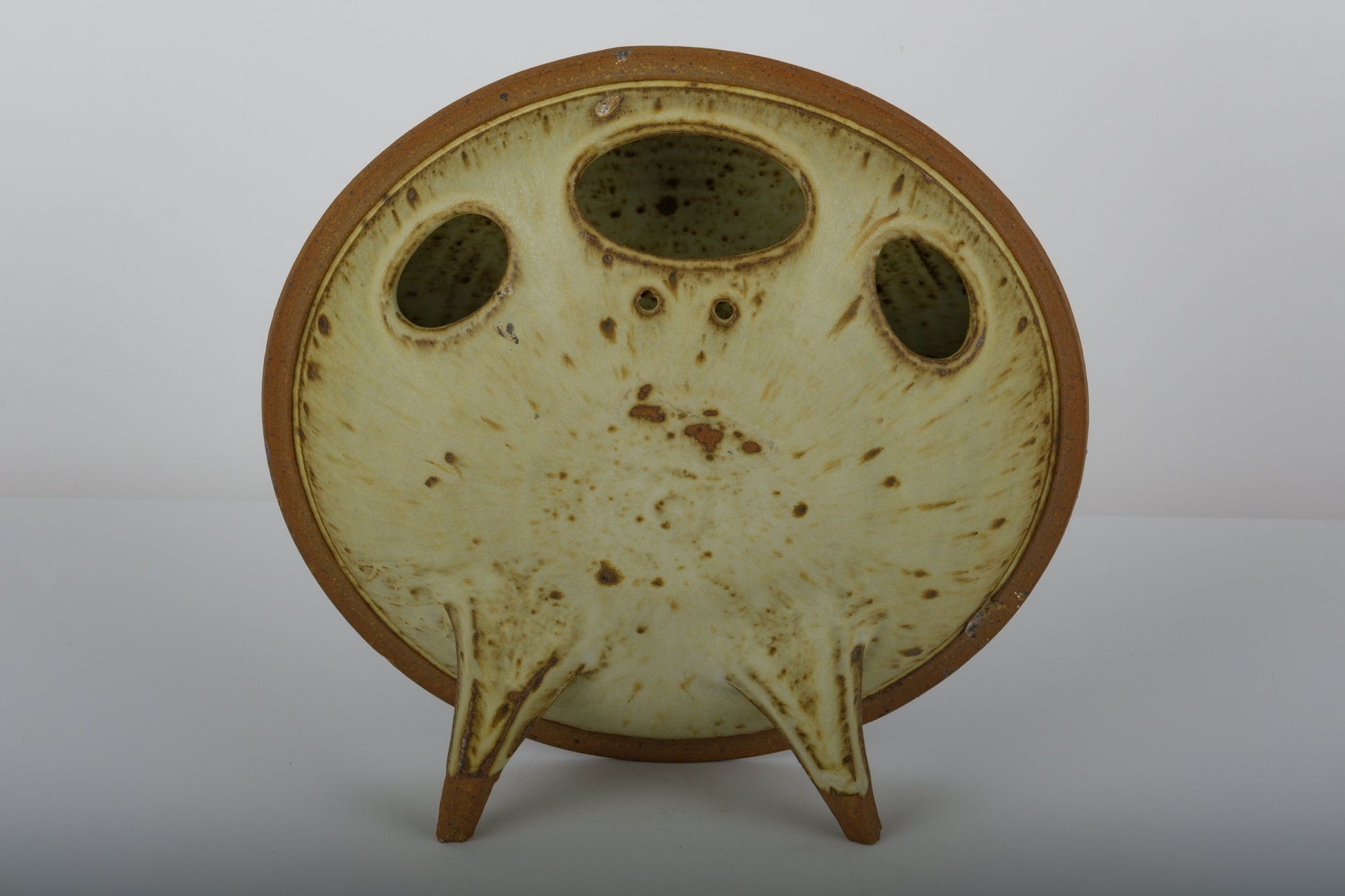 Ken Pick Studio pottery vase from the 1980s with unique oval shape and triple openings on a three-legged base