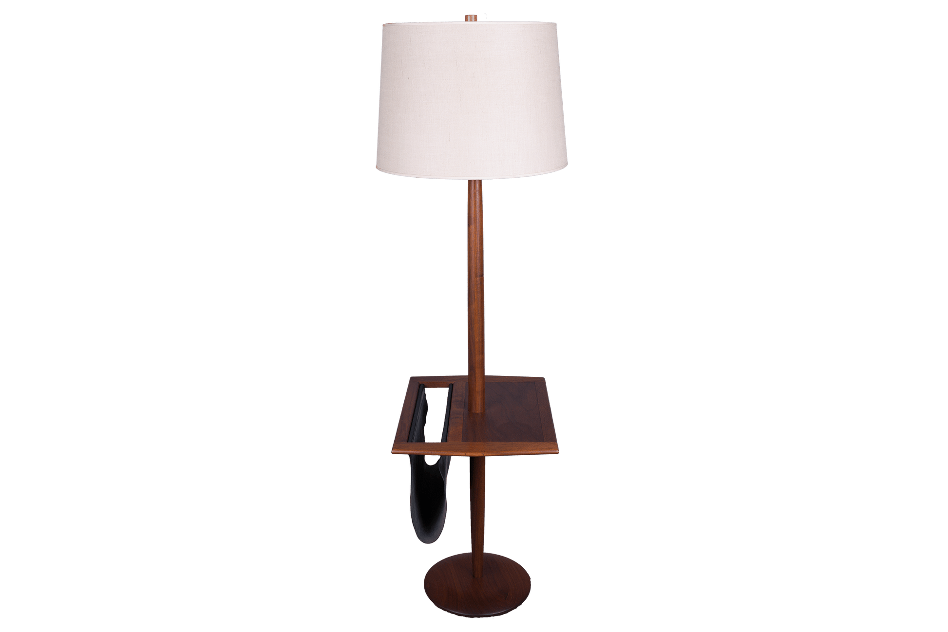 Mid-century modern wooden floor lamp with built-in side table and black leather magazine sling on round base.