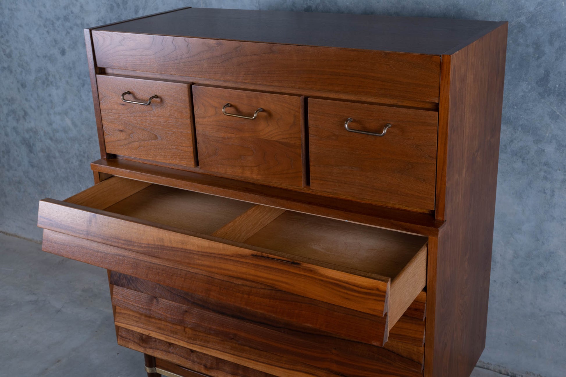 Mid-century modern walnut highboy dresser with louvered front and three open drawers by Merton L. Gershun