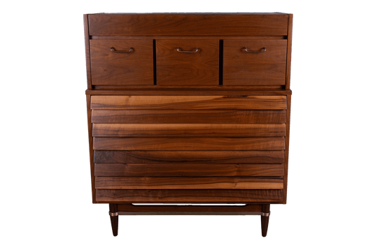1960s mid-century modern walnut highboy dresser with seven drawers and brass handles by Merton L. Gershun