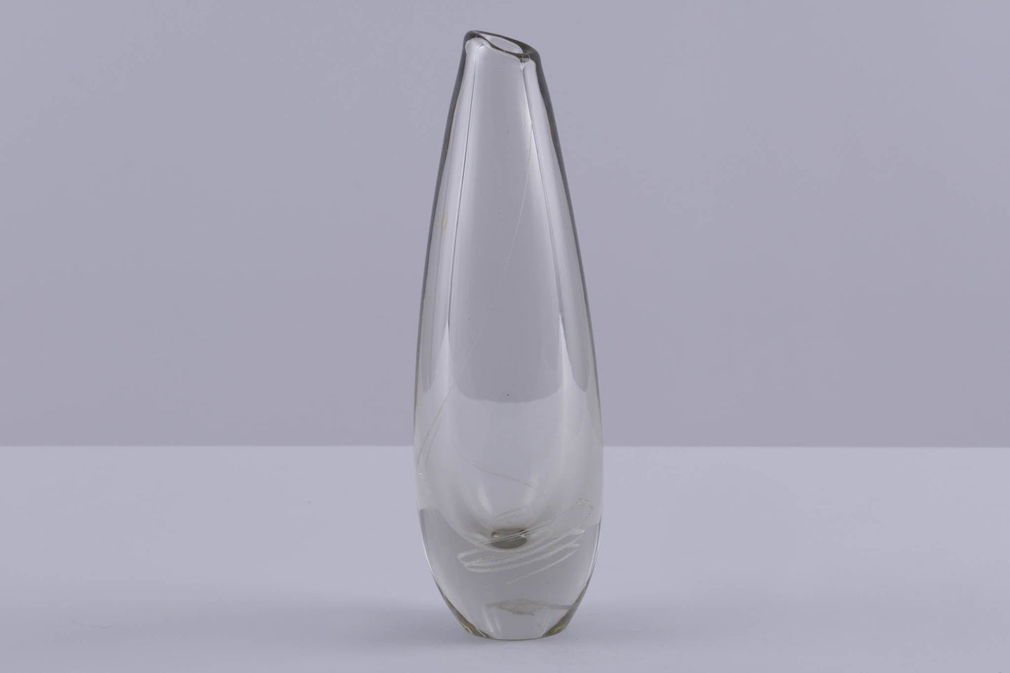 Tall clear glass vase with subtle spiral inlaid pattern, designed by Mikko Helander in Finnish Scandinavian style.