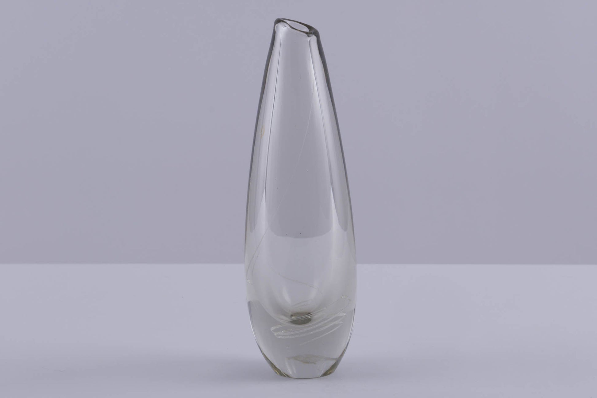 Tall clear glass vase with subtle spiral inlaid pattern, designed by Mikko Helander in Finnish Scandinavian style.