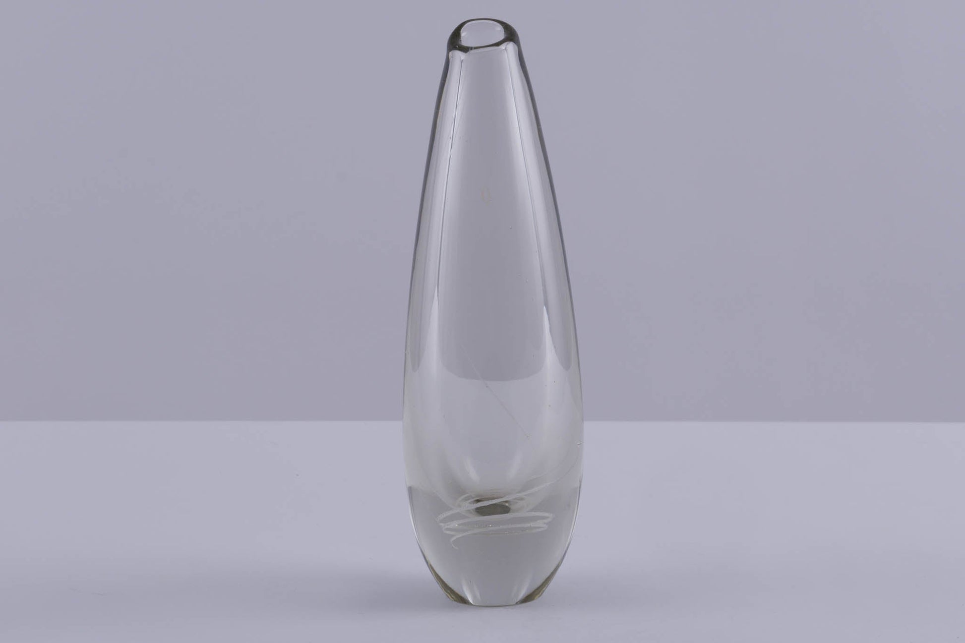 Tall clear glass vase with subtle inlaid spiral decoration, designed by Mikko Helander in Scandinavian style.