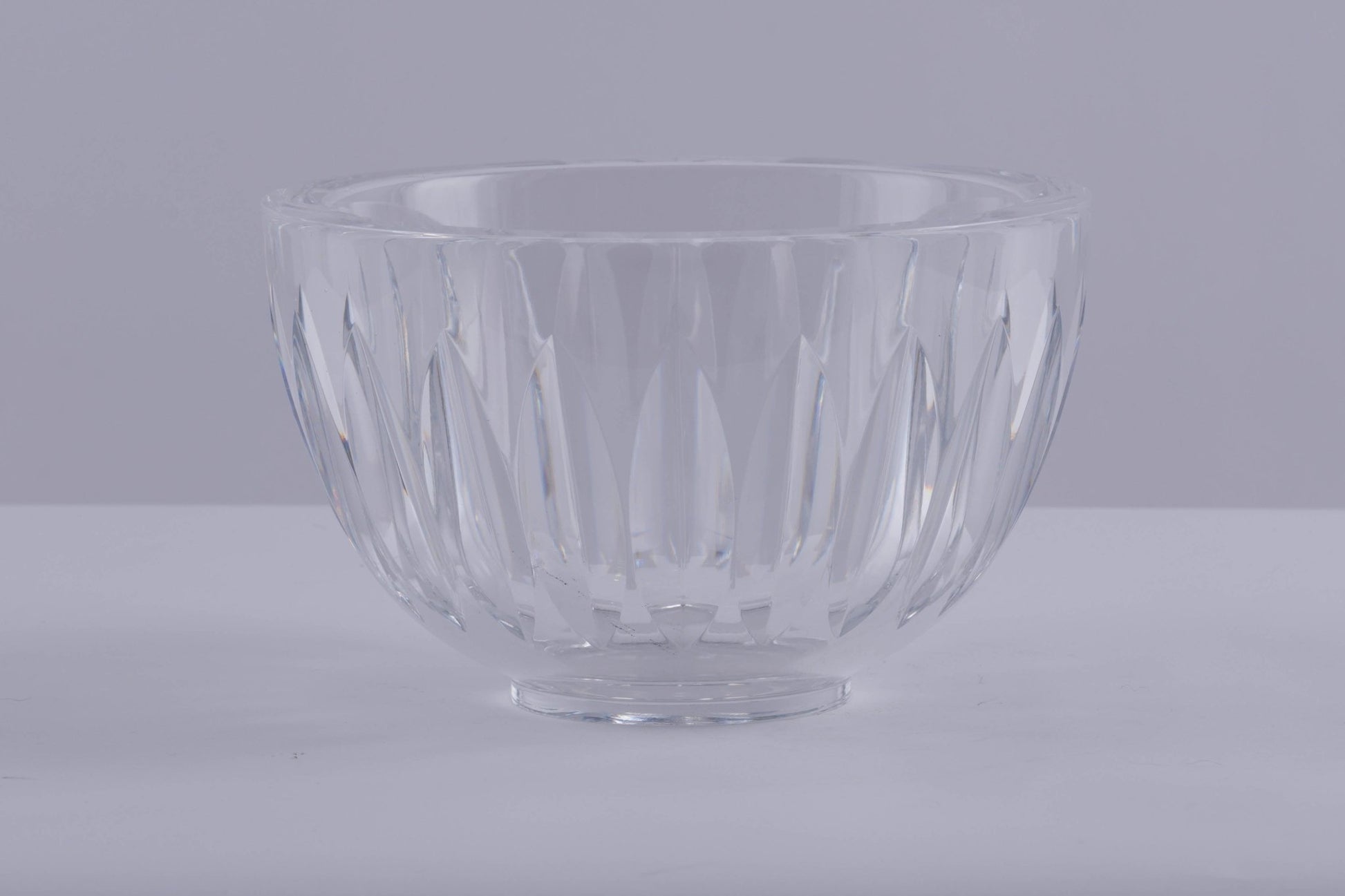 Orrefors crystal bowl designed by Sven Palmqvist with deep wedge cuts creating a prismatic light effect.