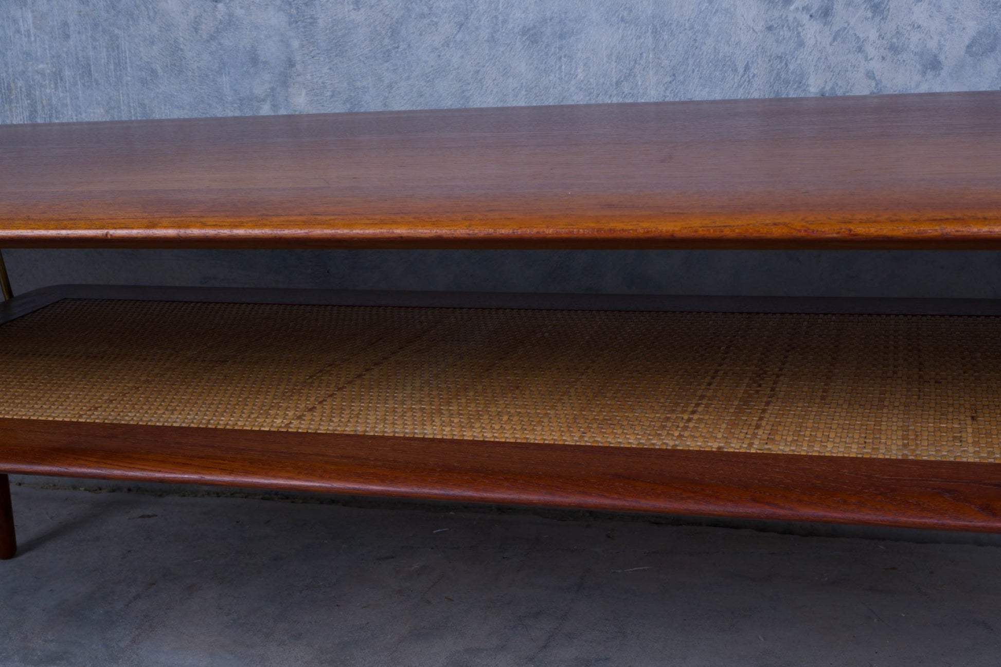 1950s Danish teak coffee table with cane shelf and clean minimalist design by Hvidt and Molgaard-Nilsen
