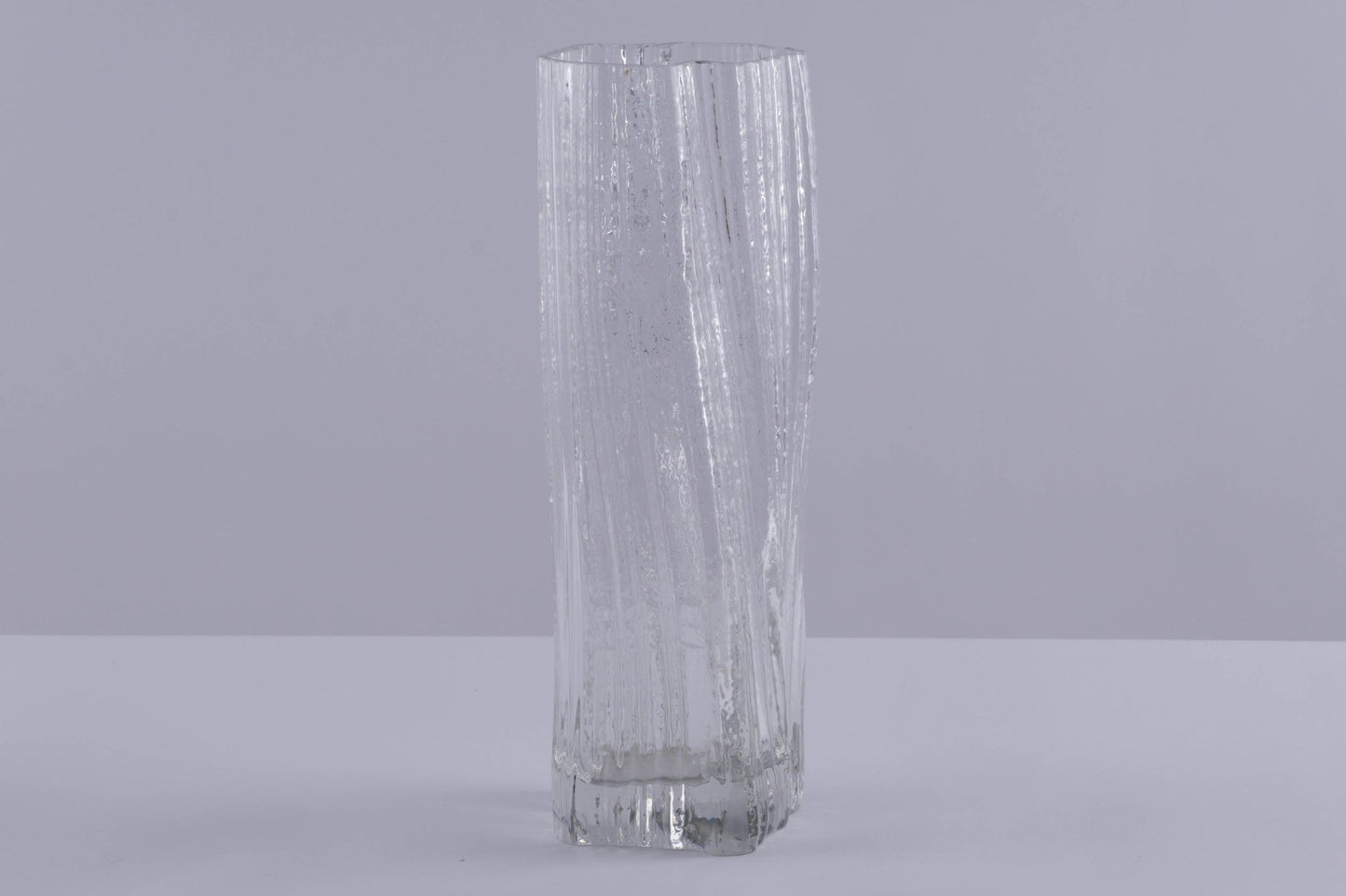Tall Rosenthal Studio Line ice glass vase with textured, vertical ribbed pattern by Martin Freyer