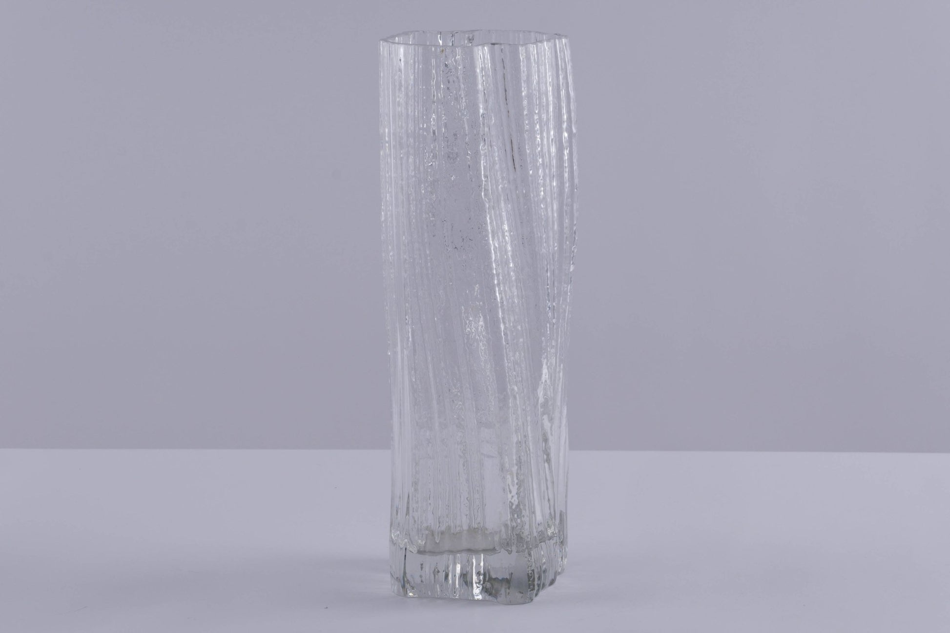Tall Rosenthal Studio Line ice glass vase with textured, vertical ribbed pattern by Martin Freyer