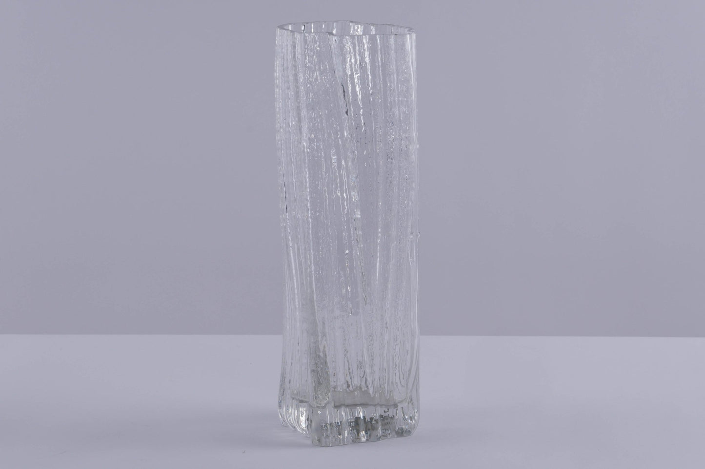 Rosenthal Studio Line clear glass vase with textured ice pattern designed by Martin Freyer, standing on gray surface