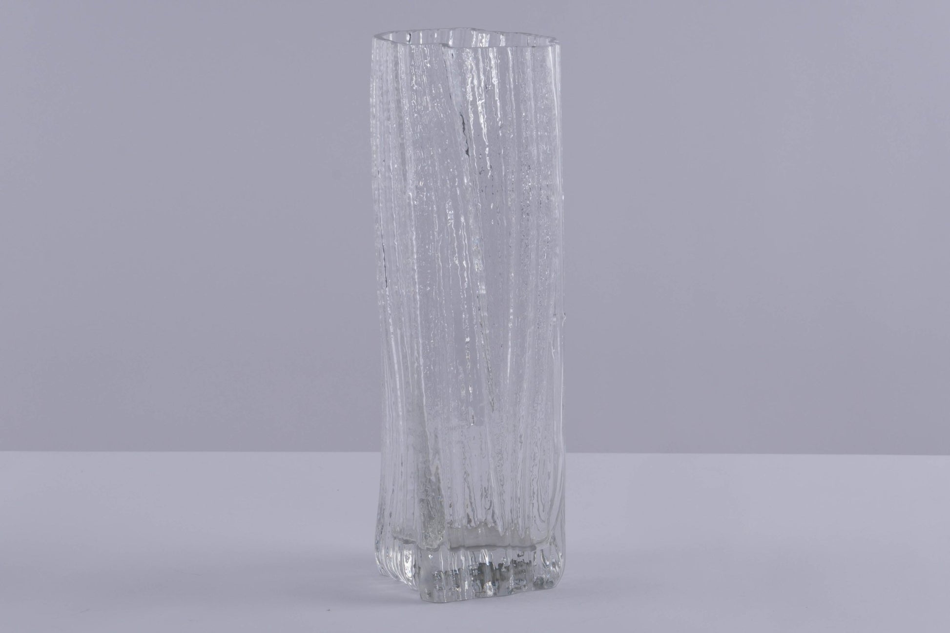 Rosenthal Studio Line clear glass vase with textured ice pattern designed by Martin Freyer, standing on gray surface