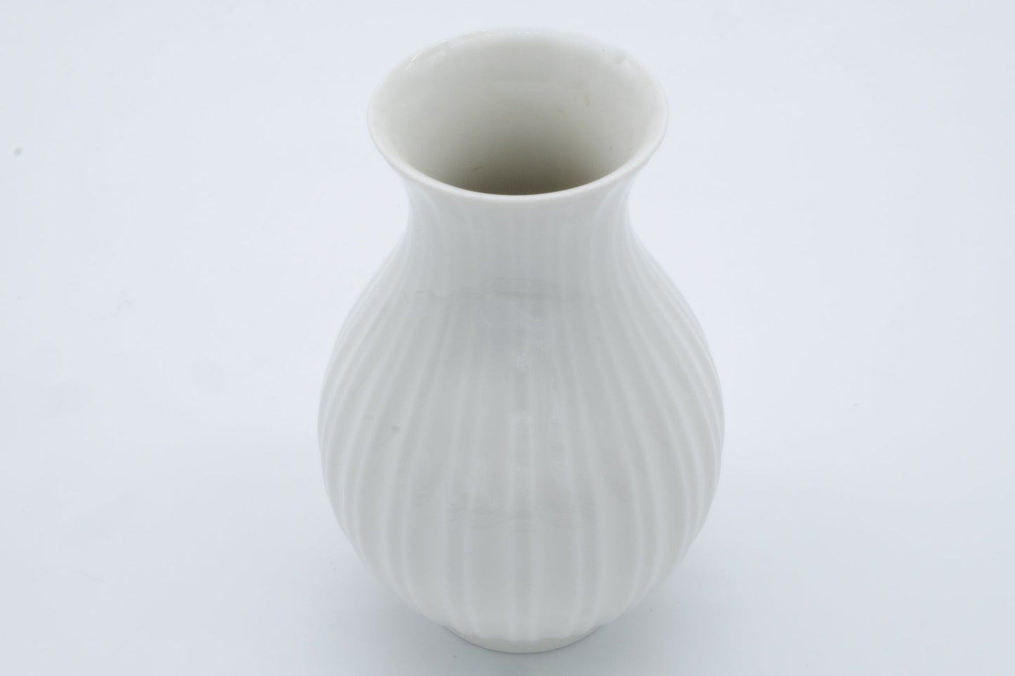 Royal Copenhagen white porcelain fluted bud vase by Thorkild Olsen with Blanc de Chine finish, Danish design.