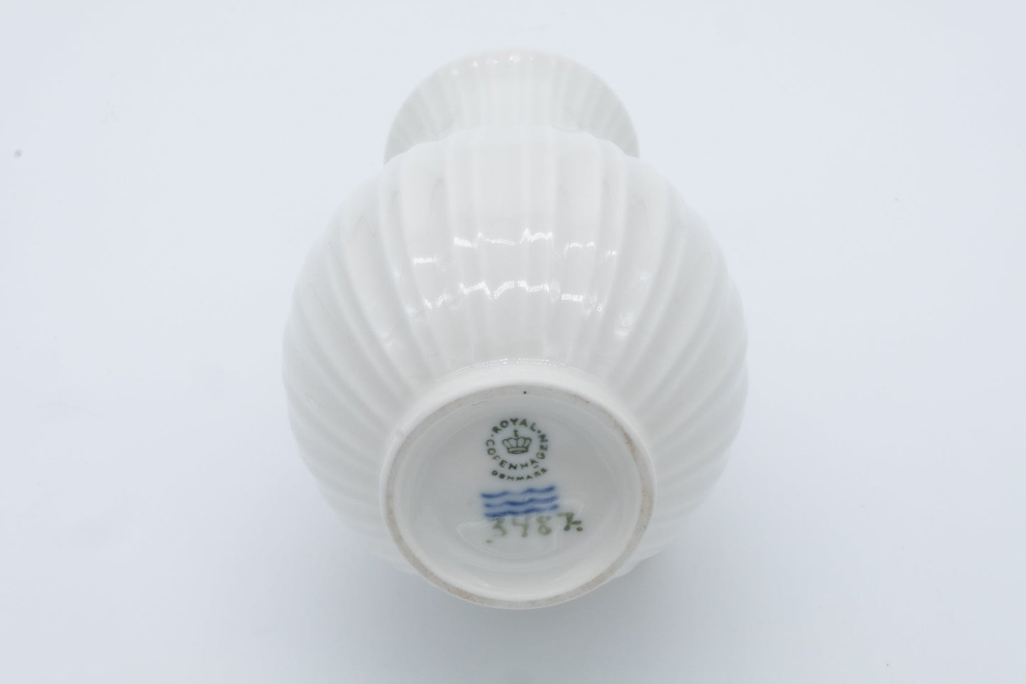 Bottom view of Royal Copenhagen white fluted porcelain bud vase with maker’s mark and model number 376K
