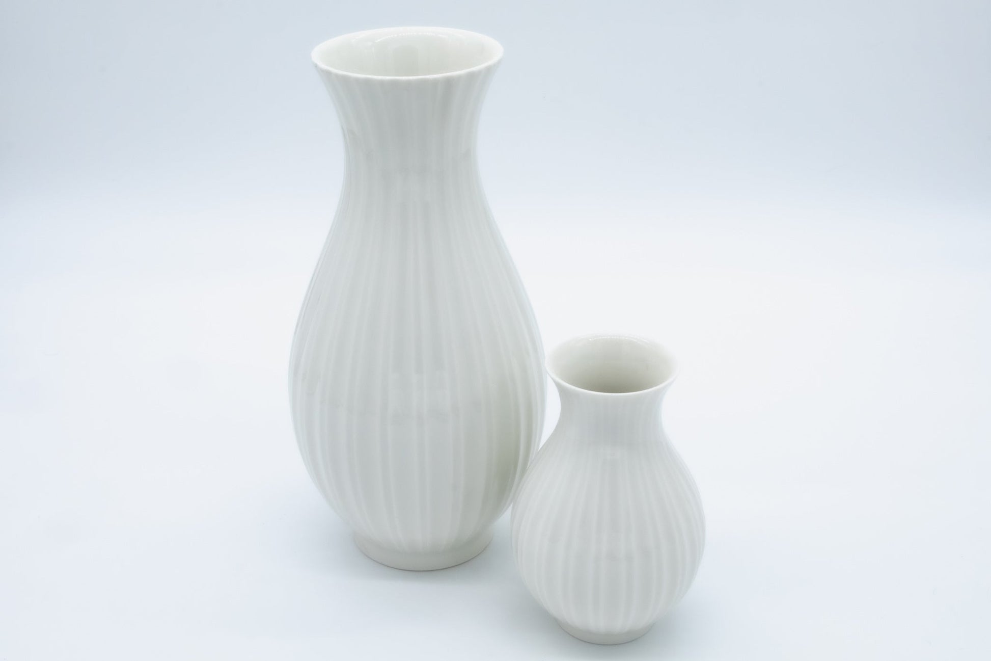 Pair of Royal Copenhagen fluted white porcelain bud vases in Blanc de Chine style by Thorkild Olsen