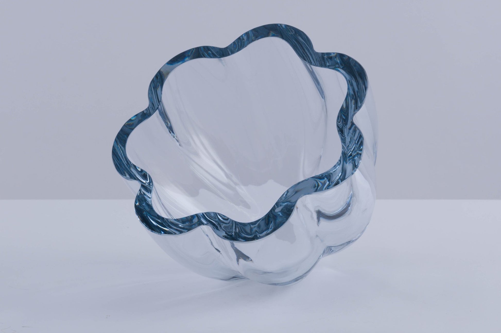 Strombergshyttan Glass Company crystal bowl with thick walls and distinctive blue wavy rim, marked T463.