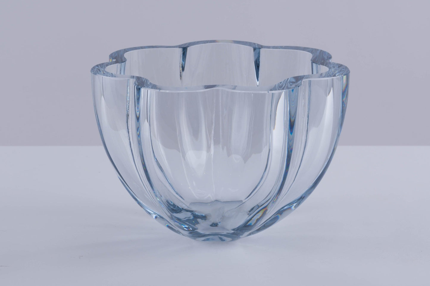 Strombergshyttan Glass Company crystal bowl with thick walls and scalloped rim, hand signed T463 in blue hue