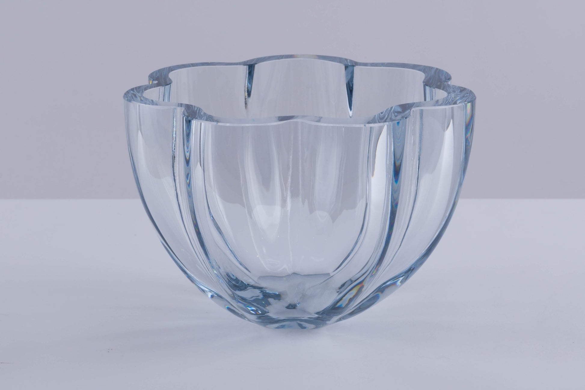 Strombergshyttan Glass Company crystal bowl with thick walls and scalloped rim, hand signed T463 in blue hue