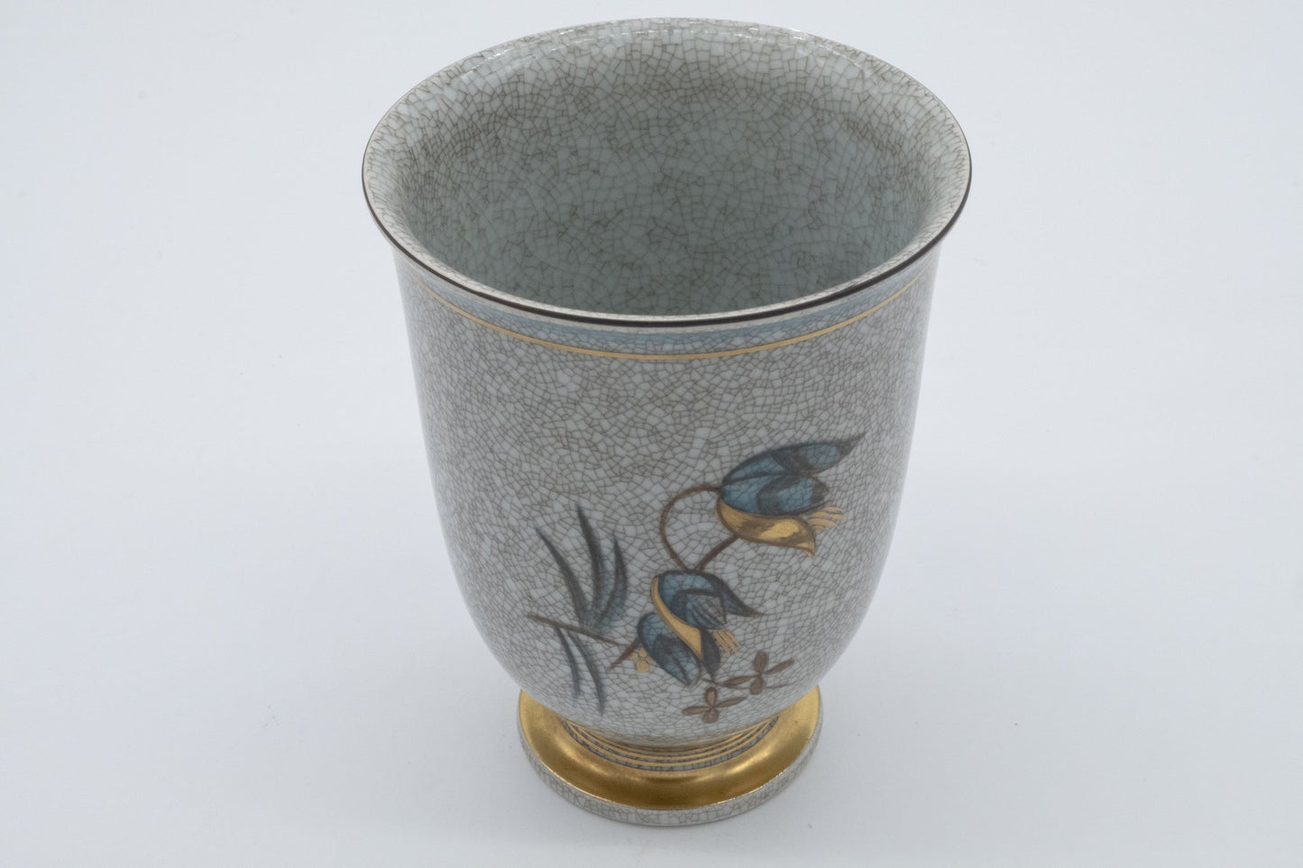 Vintage Royal Copenhagen vase by Thorkild Olsen with craquele glaze and floral and insect motifs on ceramic surface